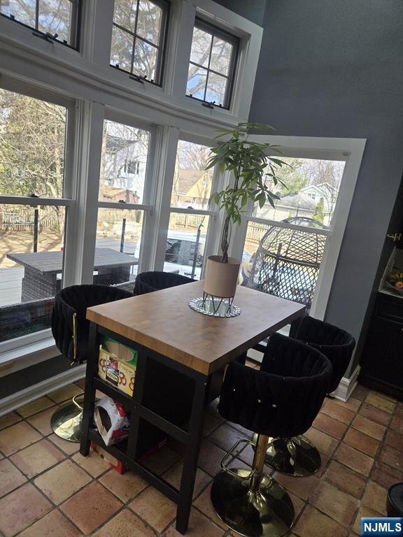 dining space featuring tile patterned flooring