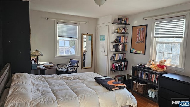 bedroom with wood finished floors