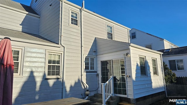 rear view of property with entry steps