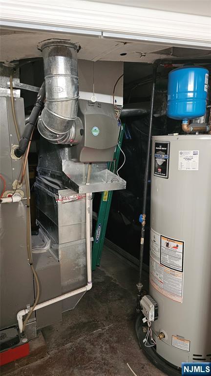 utility room featuring water heater