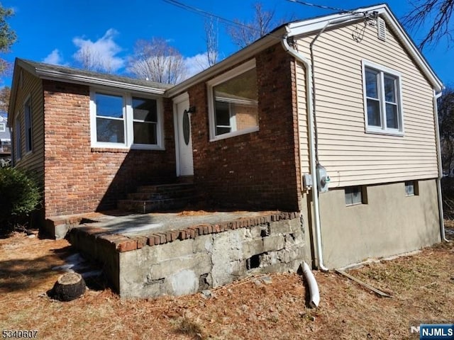 view of property exterior featuring brick siding