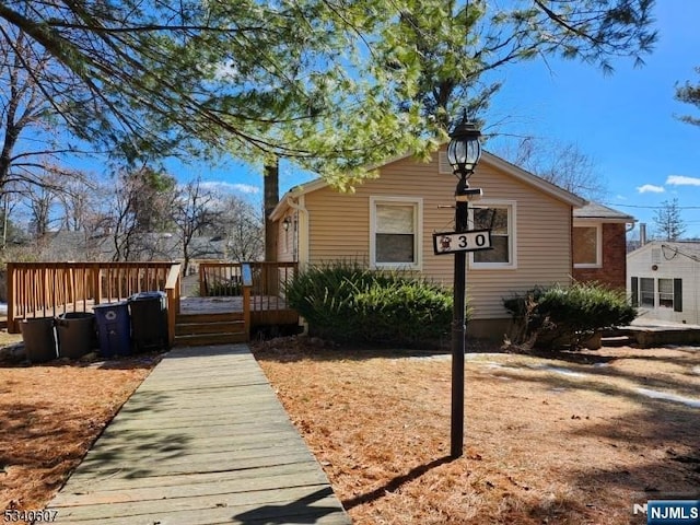 view of home's exterior with a deck