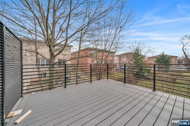 wooden deck with a residential view