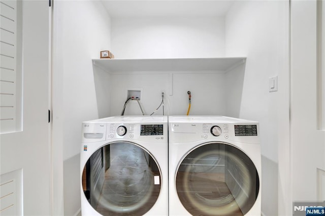 laundry area featuring washing machine and dryer and laundry area