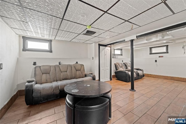 living room featuring baseboards and wood finish floors