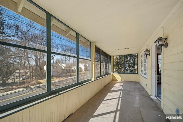 unfurnished sunroom featuring a wealth of natural light