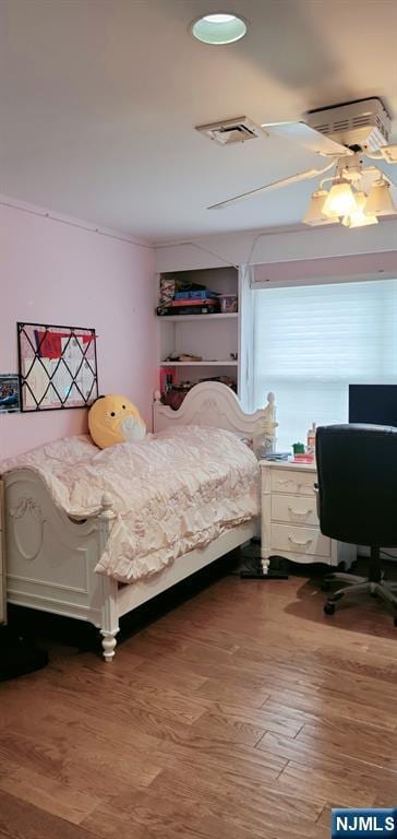 bedroom featuring light wood finished floors