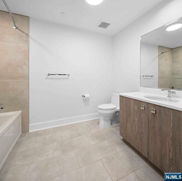 full bathroom featuring visible vents, toilet, a bathing tub, tile patterned flooring, and baseboards