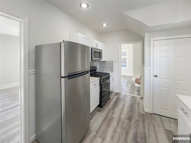 kitchen featuring light countertops, white cabinets, and appliances with stainless steel finishes