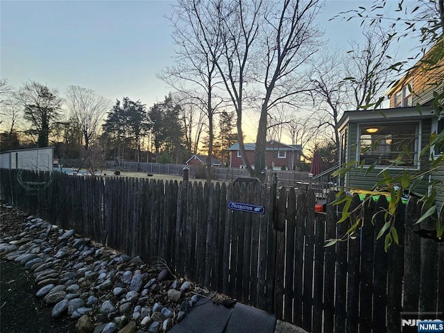 yard at dusk with fence