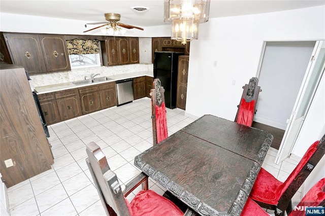 dining room with light tile patterned floors, a ceiling fan, and visible vents