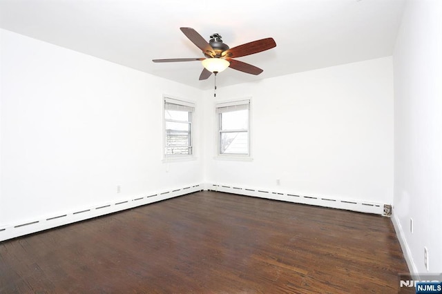 empty room featuring wood finished floors, a ceiling fan, and a baseboard radiator