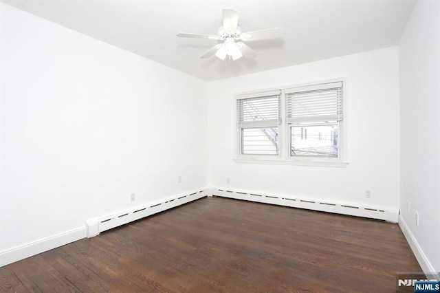 empty room with dark wood-style floors, baseboards, baseboard heating, and ceiling fan