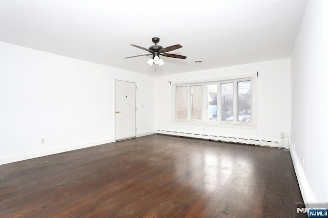 unfurnished room with baseboards, baseboard heating, wood finished floors, and a ceiling fan