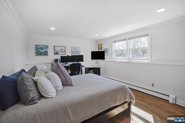 bedroom with a baseboard heating unit, recessed lighting, wood finished floors, and ornamental molding