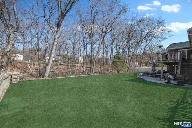 view of yard with a patio and fence