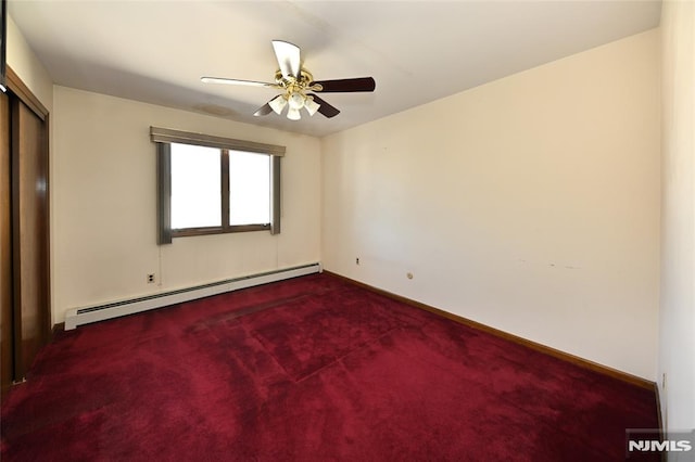 unfurnished bedroom with a baseboard heating unit, carpet floors, and baseboards