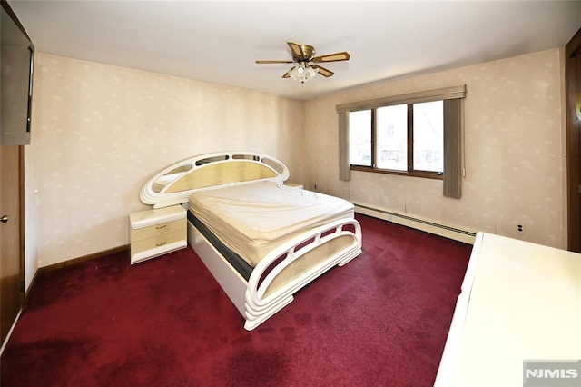 carpeted bedroom with a baseboard radiator, baseboards, and ceiling fan