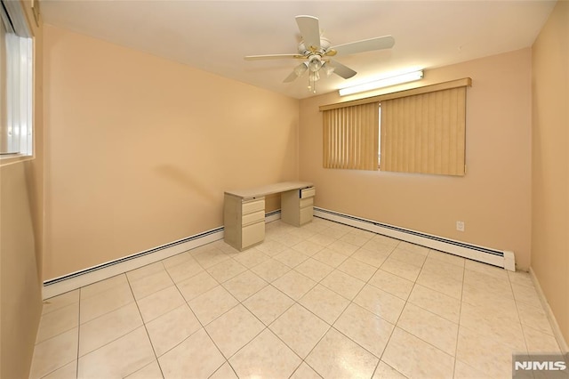 unfurnished room featuring light tile patterned floors, a baseboard heating unit, and ceiling fan