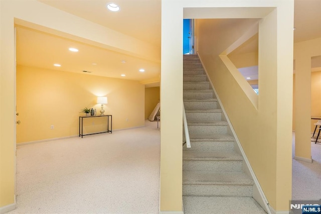 staircase with visible vents, carpet flooring, recessed lighting, and baseboards