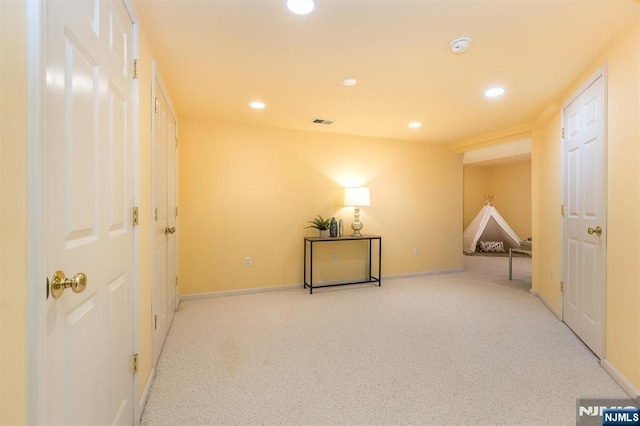 interior space with recessed lighting, visible vents, and baseboards