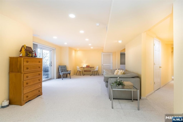 carpeted living area featuring recessed lighting