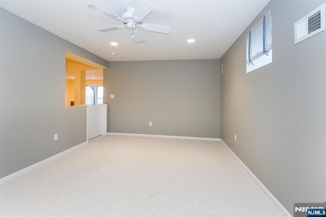 spare room featuring baseboards, visible vents, recessed lighting, ceiling fan, and carpet flooring