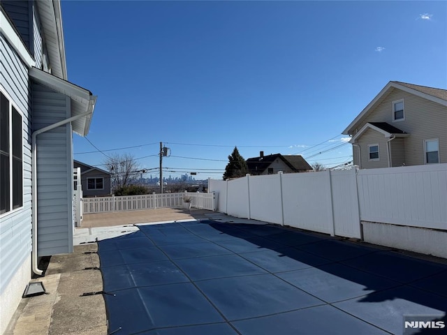 view of swimming pool with a patio area and a fenced backyard