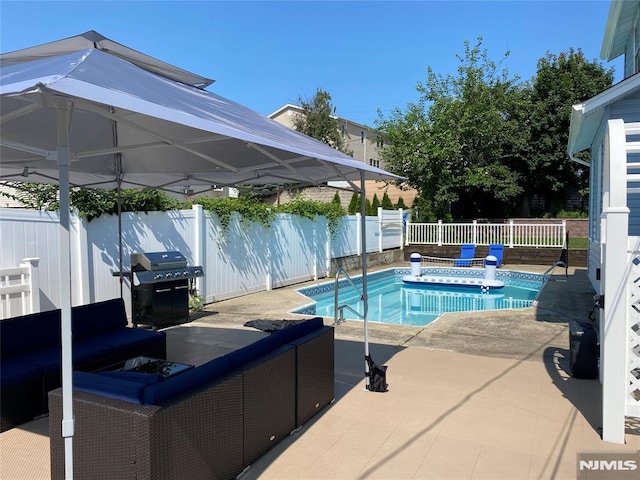 view of pool featuring a fenced in pool, area for grilling, a fenced backyard, and a patio area