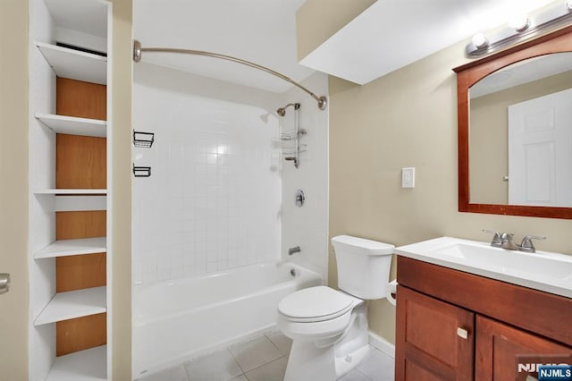 bathroom featuring tile patterned floors, toilet, vanity, and bathing tub / shower combination