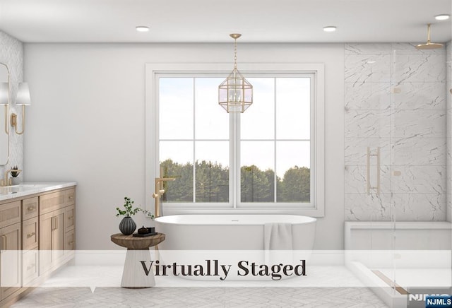 bathroom with vanity, a freestanding tub, recessed lighting, and a marble finish shower