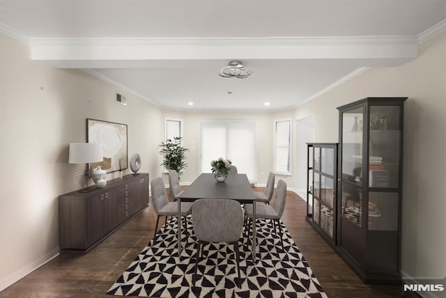 dining space with visible vents, baseboards, dark wood-style floors, and ornamental molding