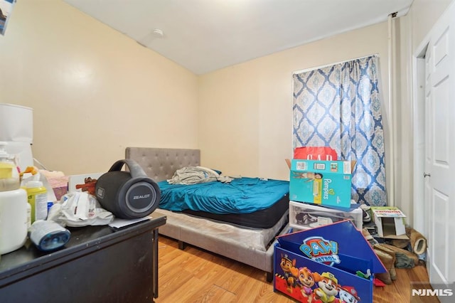 bedroom featuring wood finished floors