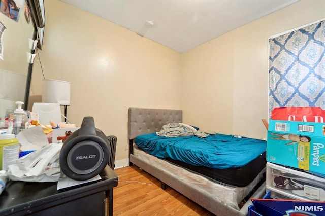 bedroom with wood finished floors