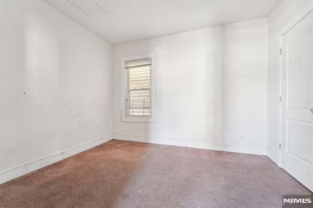 empty room with carpet flooring