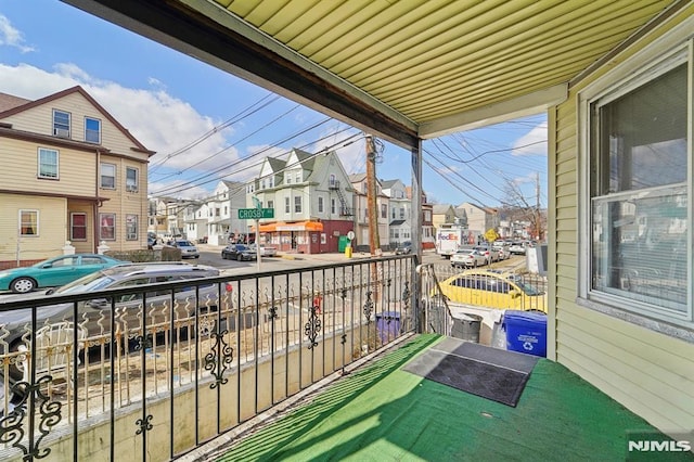 balcony featuring a residential view