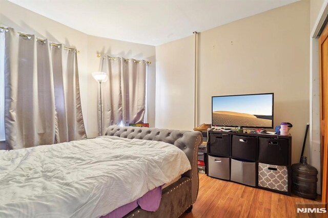 bedroom featuring wood finished floors