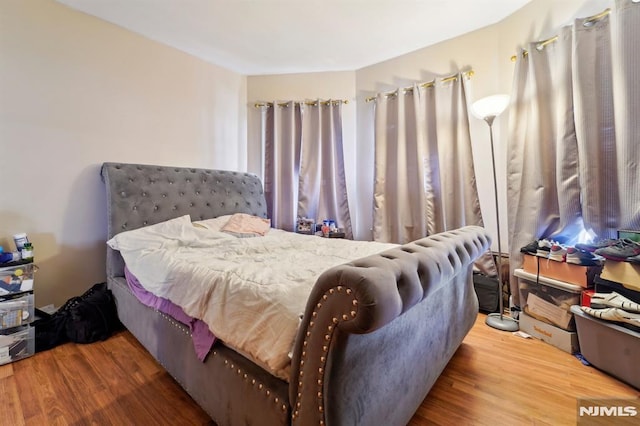 bedroom featuring wood finished floors