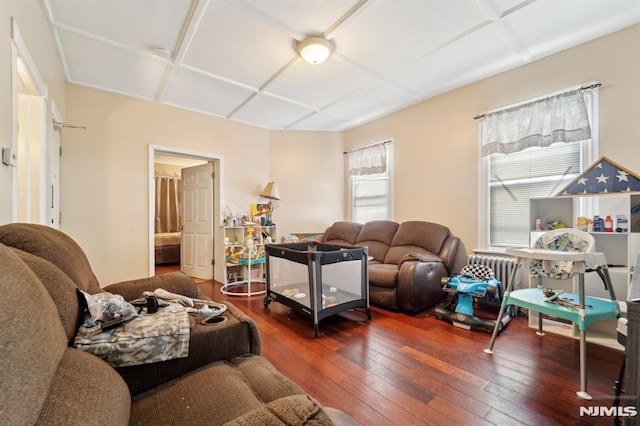 living room with coffered ceiling and wood-type flooring