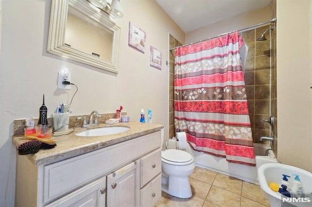 full bathroom with tile patterned floors, shower / bath combo with shower curtain, toilet, and vanity