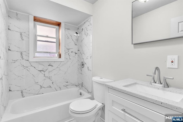 bathroom with shower / bath combination, toilet, and vanity