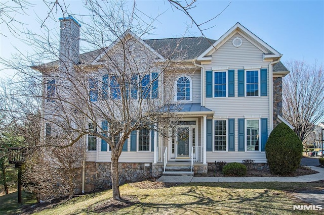 view of front of house with a chimney