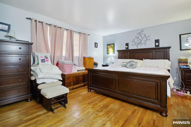 bedroom featuring light wood finished floors