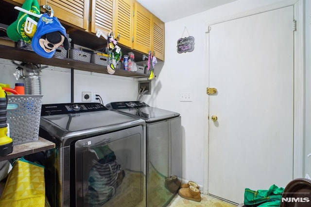 laundry room with washer and dryer and laundry area