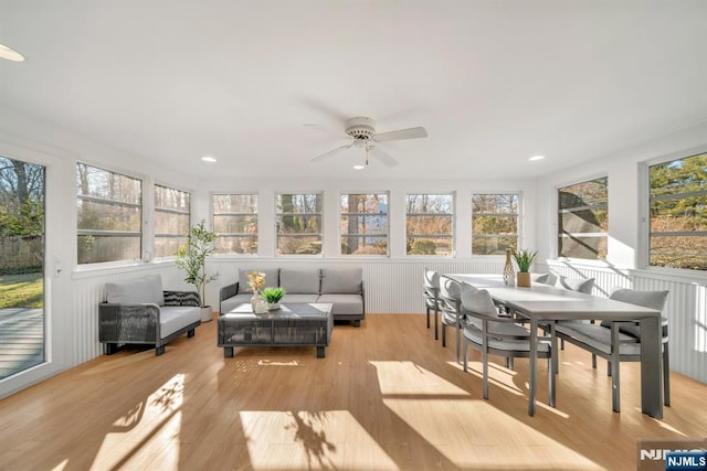 sunroom / solarium with a wealth of natural light and a ceiling fan