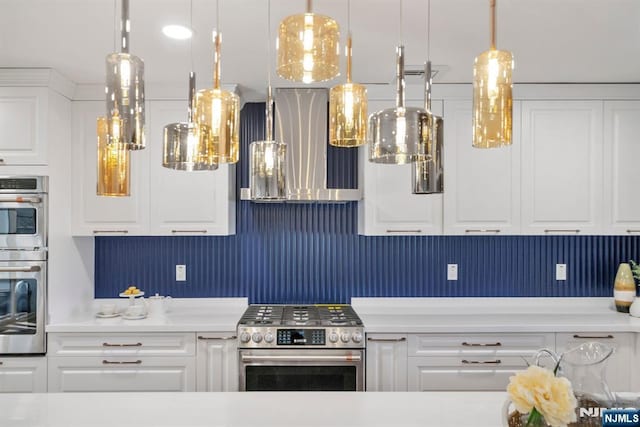 kitchen featuring white cabinetry, stainless steel appliances, light countertops, and extractor fan