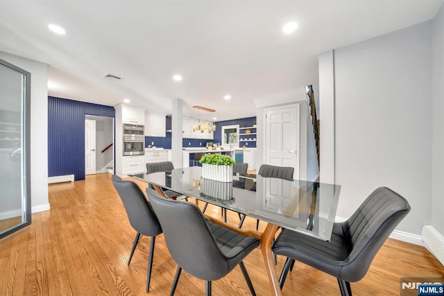 dining area with light wood finished floors, visible vents, recessed lighting, and baseboards