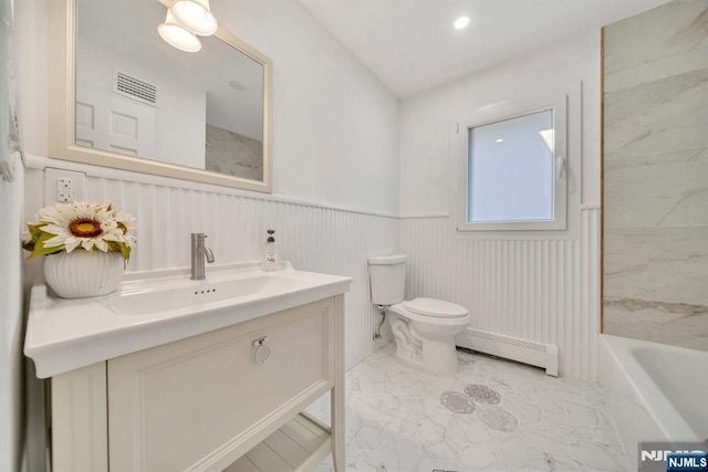 full bathroom featuring toilet, wainscoting, marble finish floor, vanity, and a baseboard radiator