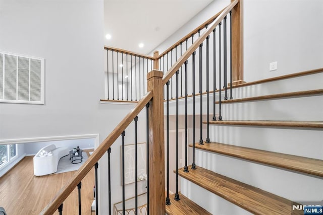 stairs with recessed lighting and visible vents