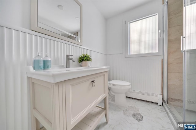 bathroom featuring toilet, marble finish floor, a stall shower, wainscoting, and baseboard heating